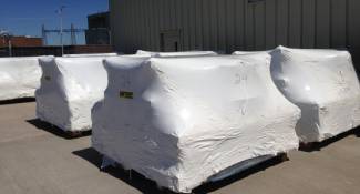 Equipment item wrapped for rail transport